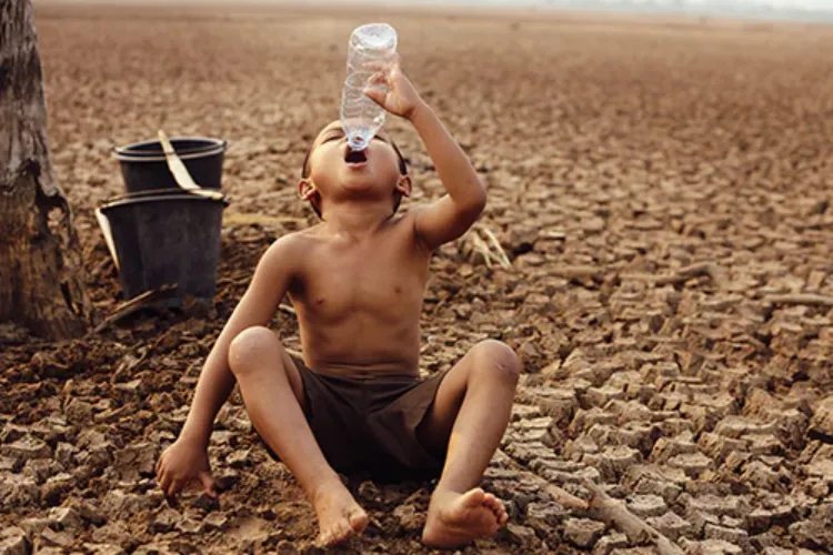 child struggling with water crisis