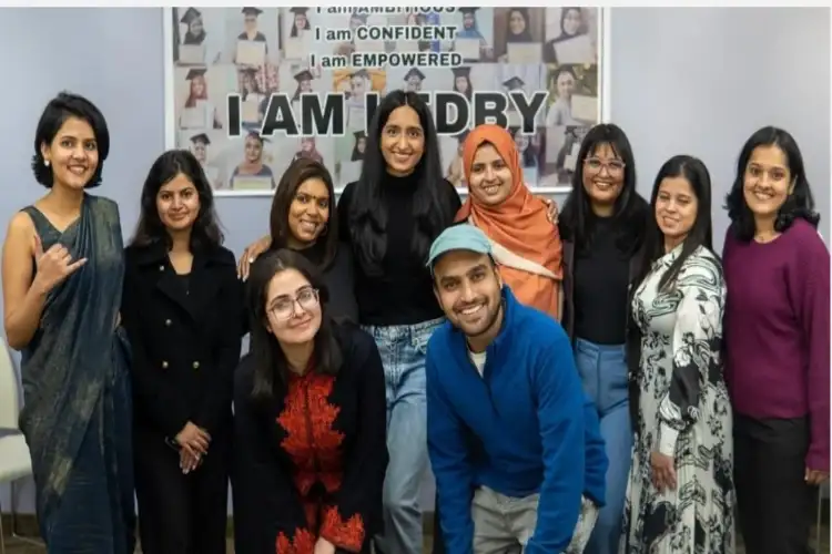 Ruha Shadab in the center(Wearing black top and jeans) with her team