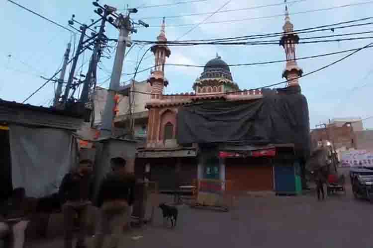 Mosque covered with tarpaulin