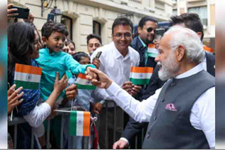 Narendra Modi kidding with a little supporter