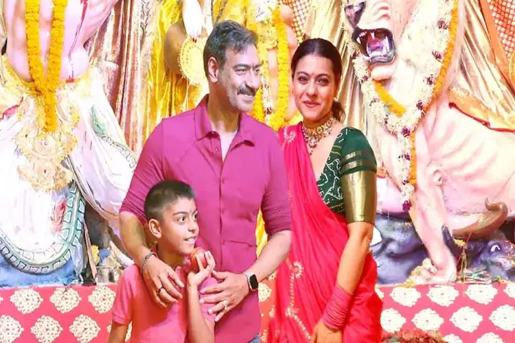 Ajay Devgn offers prayers at Dugra Puja pandal with wife Kajol, son Yug