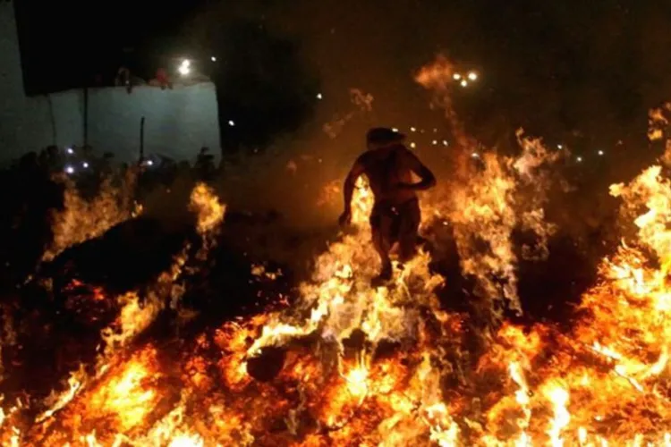 A unique tradition of Holi in Braj, the priests come out safely from the fire burning in devotion to Prahlad