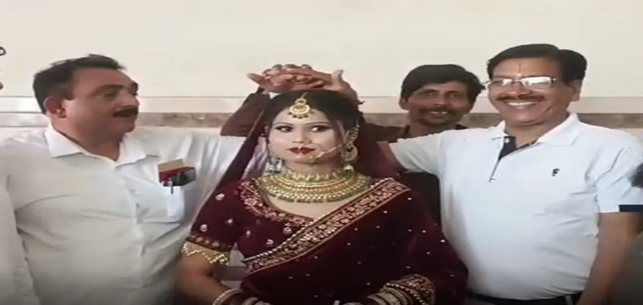 Rakhi's Bade papa Safdar Nawaz Khan is on her left and father Gautam Kumar is on her right