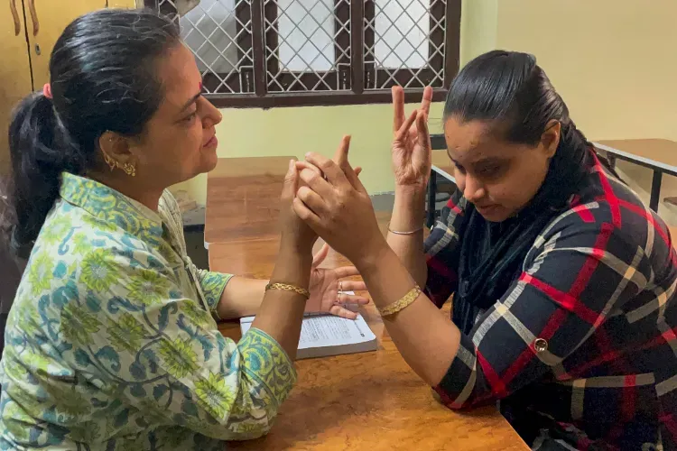 34 year old woman who is unable to speak, hear and see passed 12th class exam