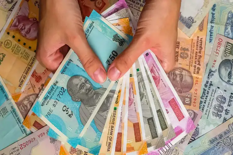 Rupee weakens 15 paise to 86.10 per dollar in early trade