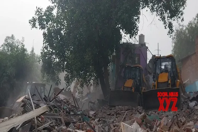 Delhi: Demolition drive underway at Jangpura's Madrasi Camp to clear Barapulla drain