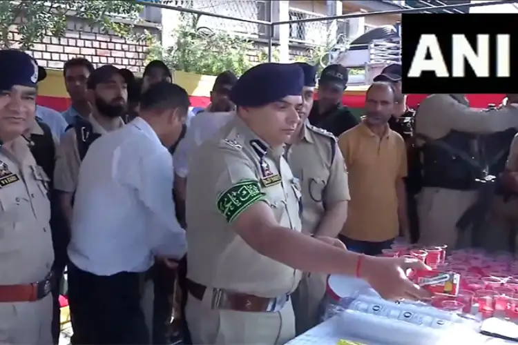 Srinagar: Senior police officials distribute water among Shia mourners participating in Muharram procession
