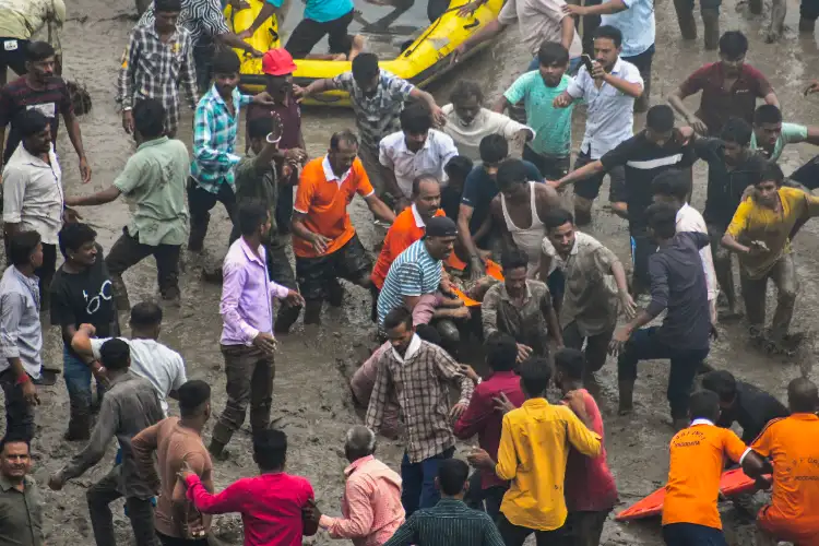 Eight killed as vehicles fall into river after bridge collapse in Vadodara