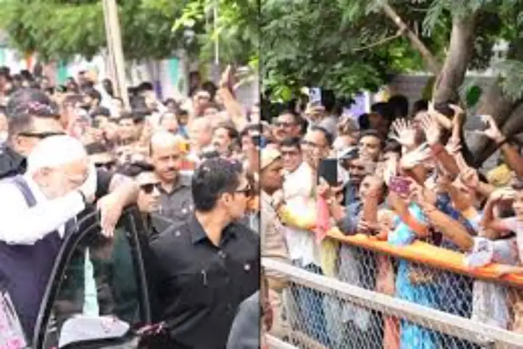 Gujarat: PM Modi responds to a child with a salute during Bhavnagar roadshow