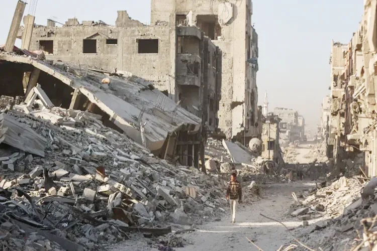 Palestinians search for their dead relatives by removing debris with their bare hands.
