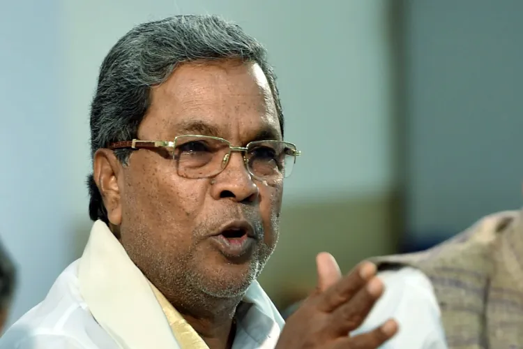 Karnataka CM Siddaramaiah warns of action against officials delaying investments.
