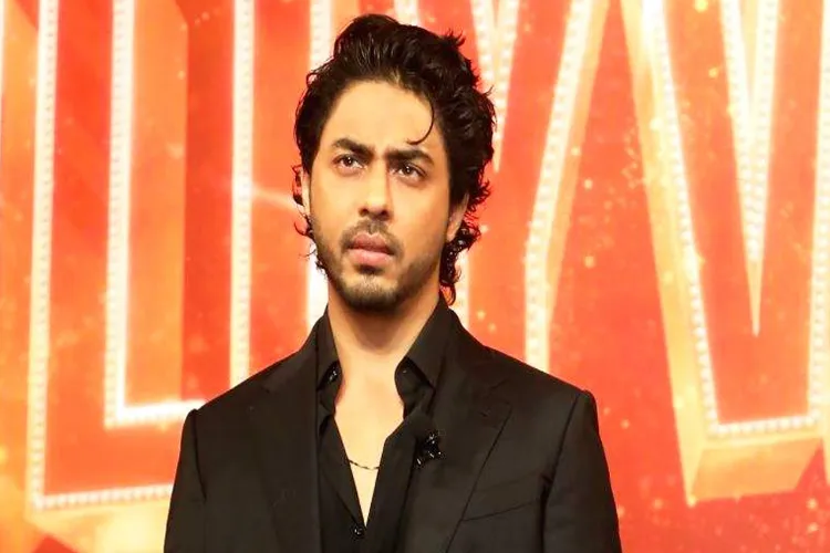 Why does Aryan remain serious in front of the camera?