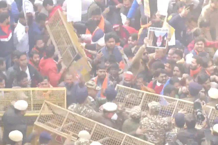 Delhi: VHP protesters clash with police, break through barricades during a demonstration against the killing of a Hindu youth in Bangladesh.