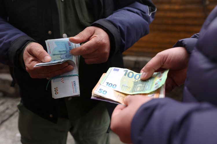Iran's currency plummets to a record low of 1.6 million rials per dollar