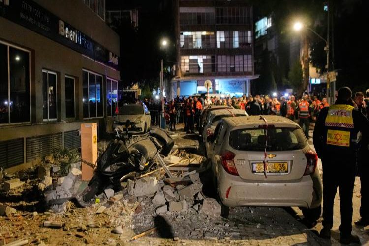 Israeli strikes kill two top Iranian officials, prompt Iran to fire a barrage of missiles