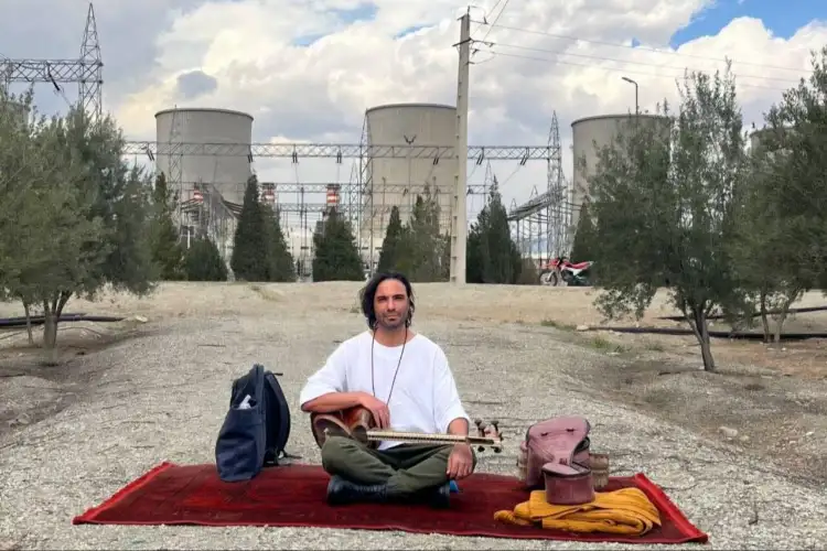 Iranian musician Ali Ghasmari performs outside Damavand power plant after Trump threat to target key infra