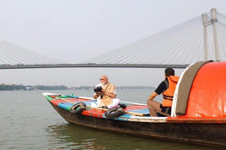 PM takes boat ride on Hooghly River in Kolkata, clicks photographs