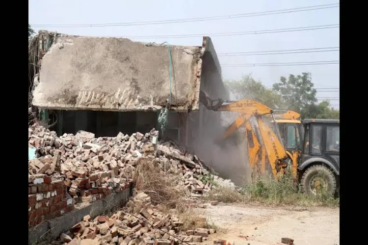 Two-storey shrine-like structure demolished in Ghaziabad; encroachment on government land alleged.