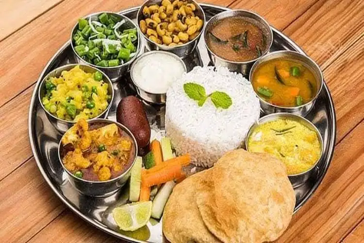Household meal costs seen staying elevated as tomato, LPG prices keep pressure on: Crisil