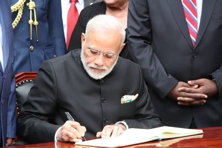 PM Modi signs Visitors' Book at Government House in Melbourne