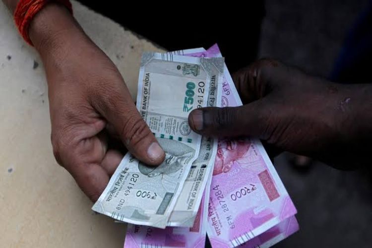 Rupee gains 12 paise to 96.24 per dollar