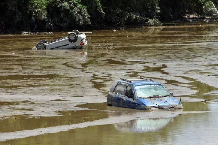Assam over phone and took stock of the flood situation in the state.