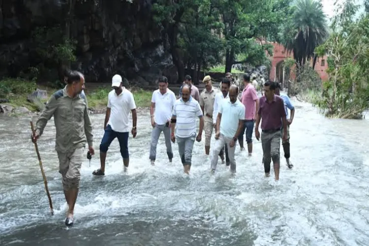 Why do village roads get submerged during the Sawan rains?