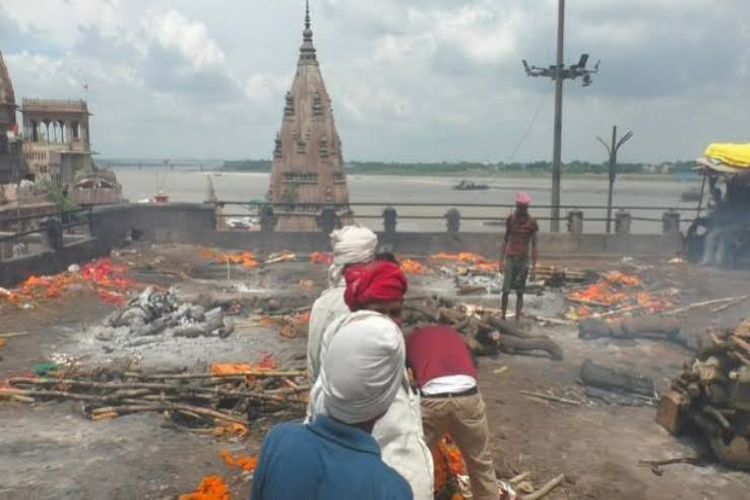 Ghats submerged in floodwaters in Varanasi, cremations taking place on stairs and rooftops