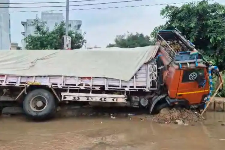 Haryana: Cement-laden truck sinks into road in Gurugram Sector 9 amid heavy rain, waterlogging