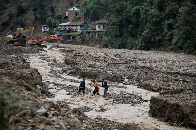 Nepal floods: Piles of bodies and graves dug to bury them tell the story of devastation