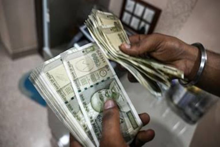Rupee marginally down 2 paise to 94.97 per dollar