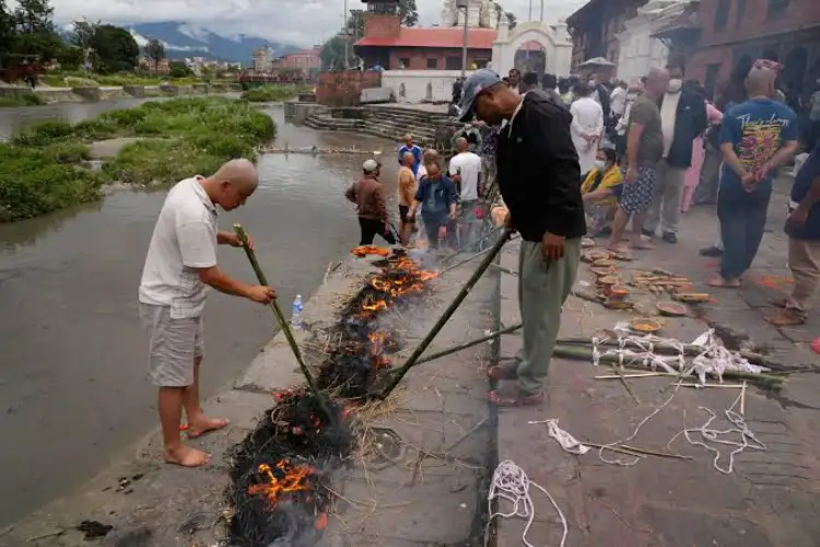 Nepal flash floods: Emotions run high at Trishuli Monastery a families perform last rites for missing loved ones 