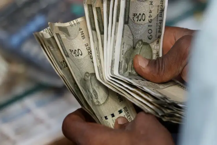 Rupee likely to trade in Rs 94.5-96 range in near term as dollar inflows fail to lift currency: Report