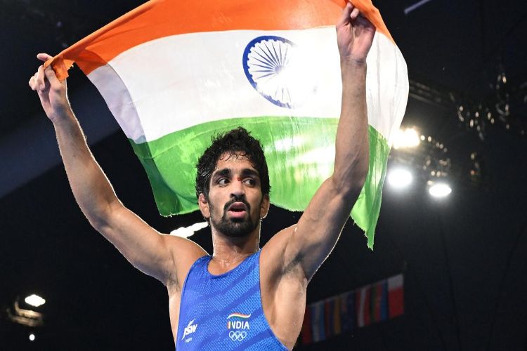 Aman wins gold medal, last race too