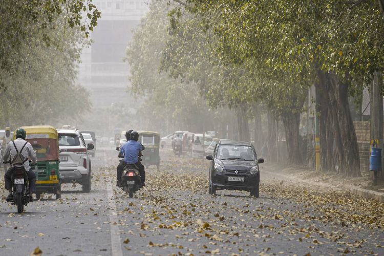 Weather cools down in Delhi due to heavy rain and strong winds; IMD issues ‘Red’ alert.