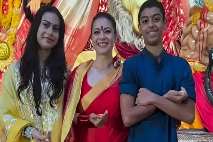 Kajol’s daughter Nysa looks graceful in red suit as she arrives at pandal to bid adieu to Maa Durga