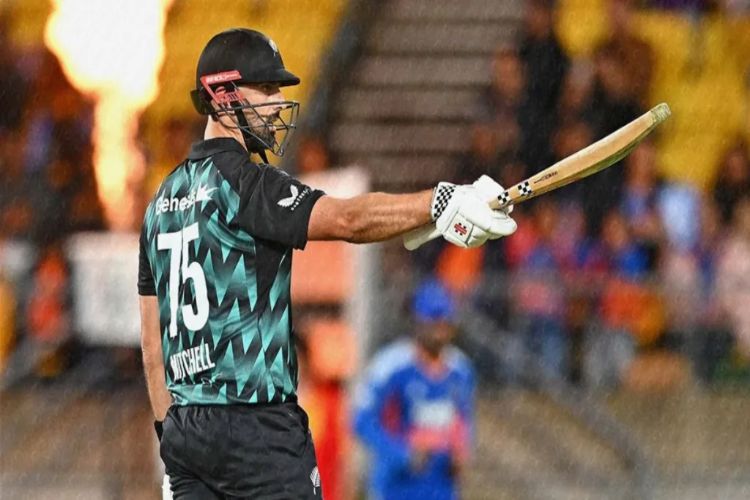 Mitchell's aggressive batting helped New Zealand post 198 for 3 against India.