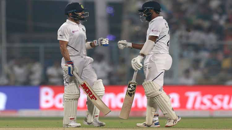 भारतीय कप्तान विराट कोहली और बल्लेबाज चेतेश्वर पुजारा