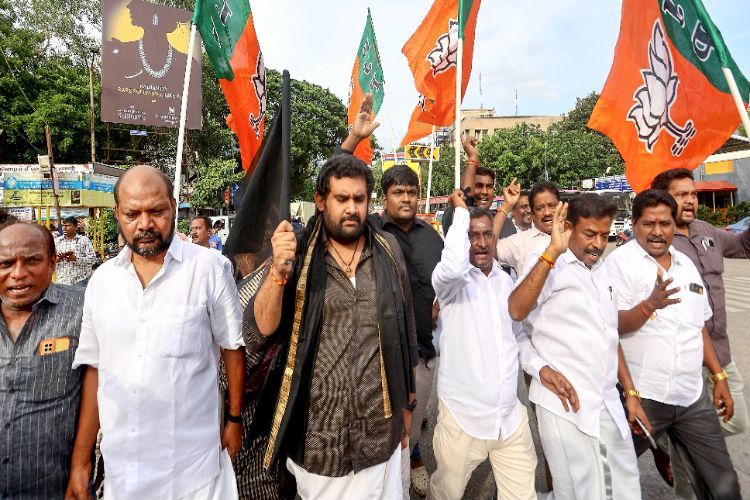 Chennai: BJP workers stage a sit-in protest against DMK's attempts to influence voters.